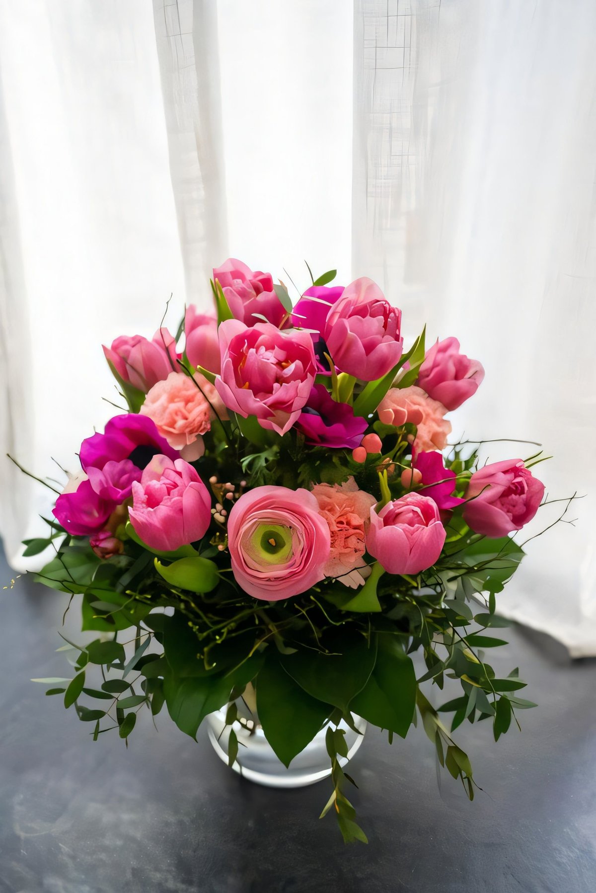 Vibrant bouquet of pink and peach flowers