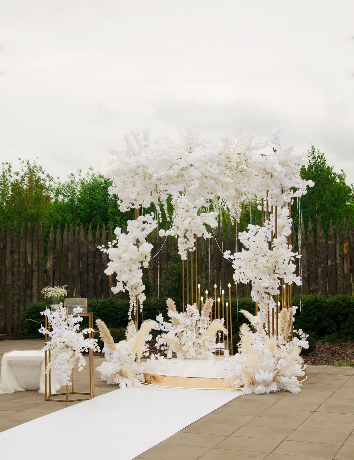 Luxury wedding arch with white roses and dried flowers