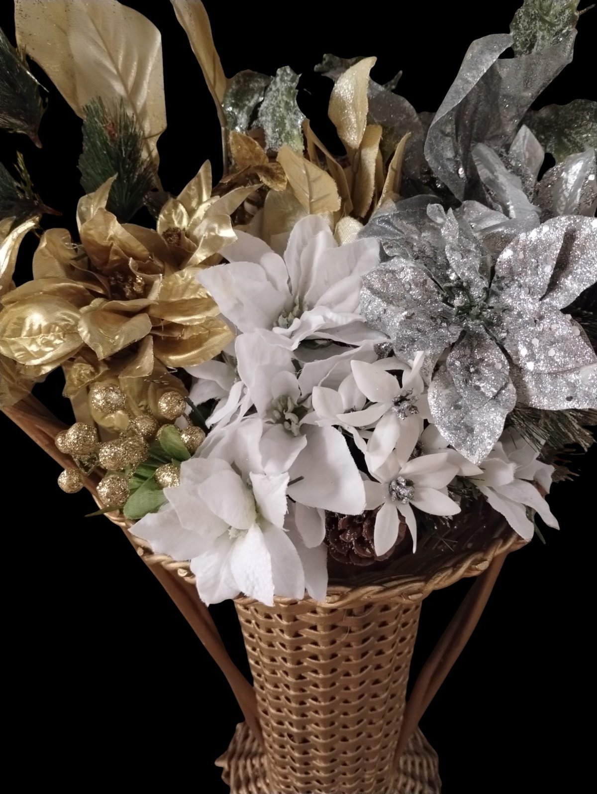 A gold, silver, and white flower bouquet