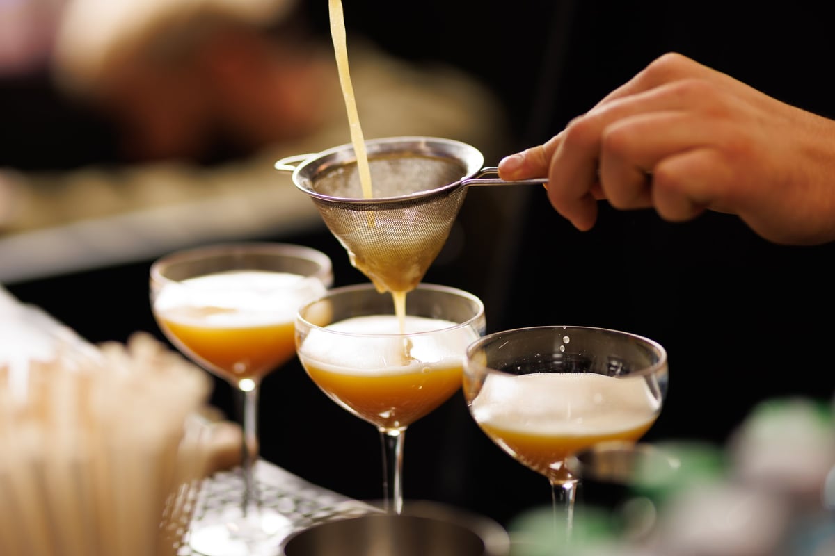 Professional bartender serving cocktails at elegant event